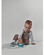 3333151171_2026_TinyLove_WoodenStackingTower_FarmersFunday_Lifestyleimage_whitebackgroundlittleboy